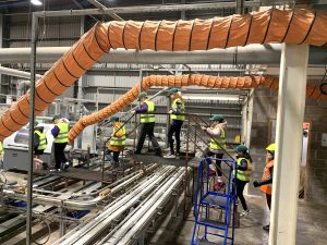 Doonfoot Primary School pupils crossing the briquette production line at Land Energy.